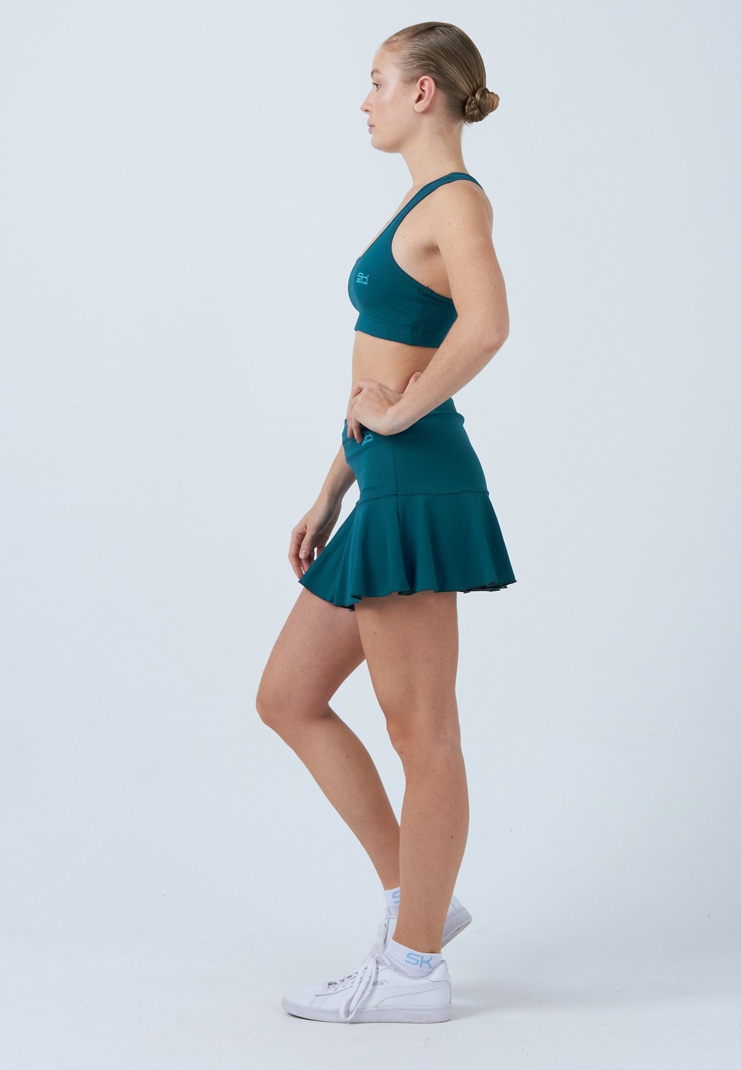 Glockiger Tennisrock / Skort, petrol grün