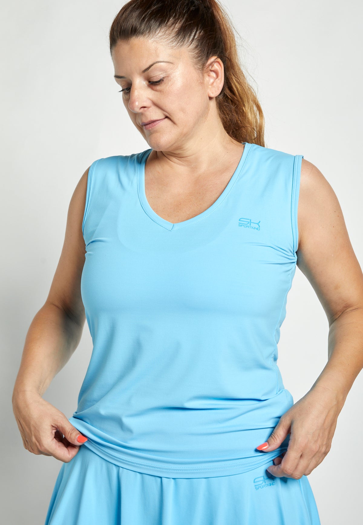 Mädchen & Damen Tennis Loose Fit Tanktop V-Neck, hellblau von SPORTKIND